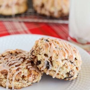 cinnamon swirl raisin biscuits with icing on a plate