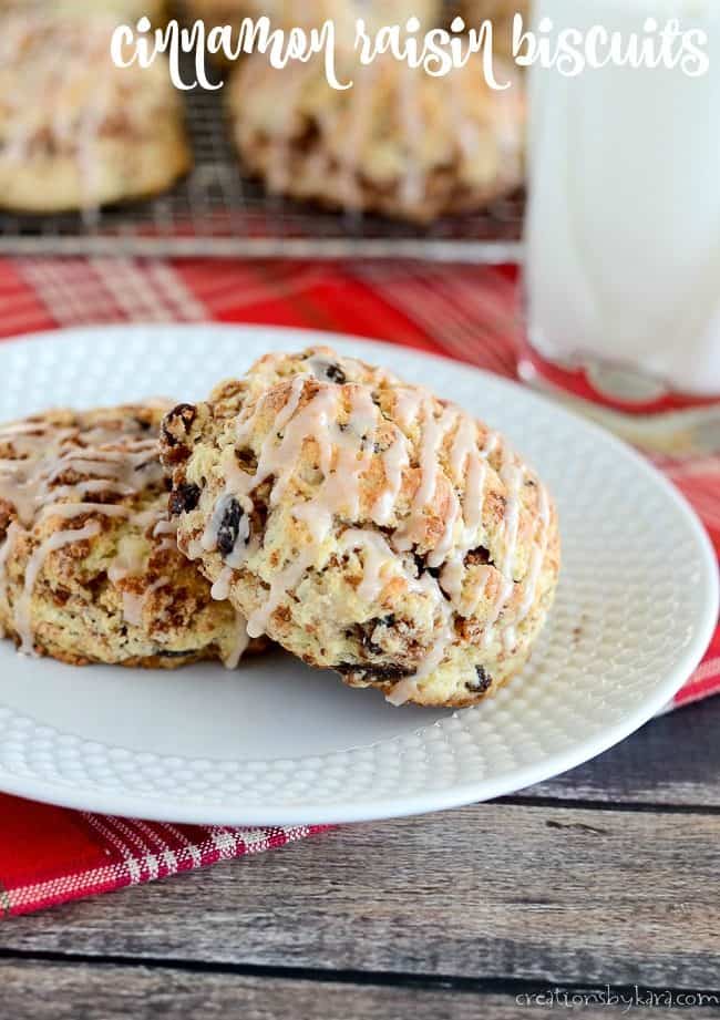 cinnamon raisin biscuits on a plate with a glass of milk