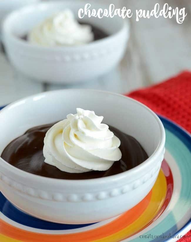bowl of warm chocolate pudding with whipped cream
