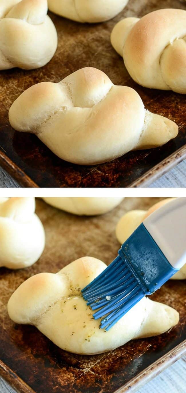 soft garlic knots being brushed with butter garlic glaze