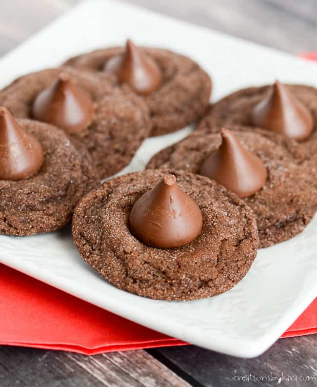 chocolate kiss cookies on a white plate with a red napkin