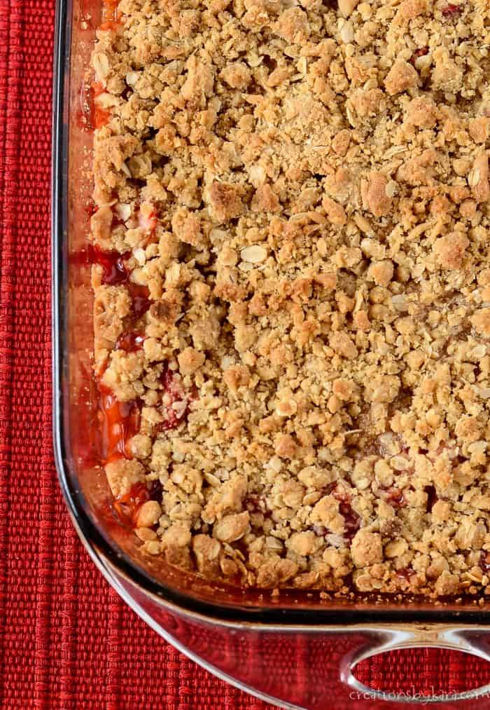 Pan of strawberry rhubarb crisp with oatmeal topping