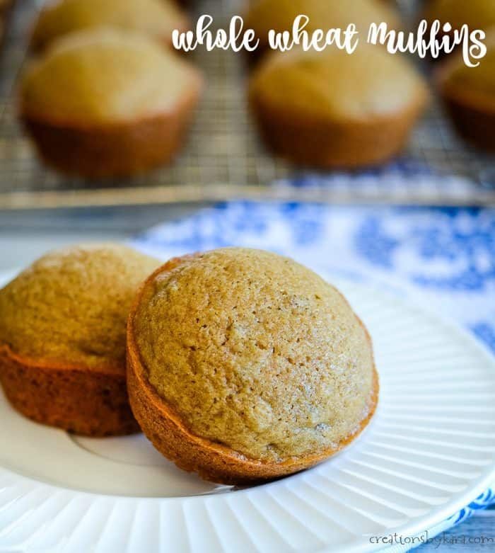 plate of whole wheat muffins on a plate with a cooling rack in the background