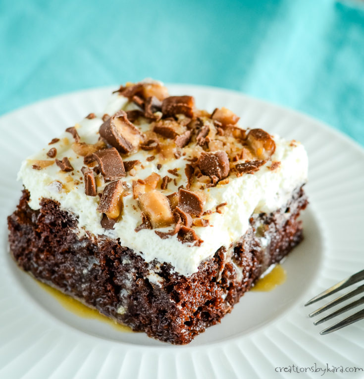 slice of chocolate cake with caramel, Heath, and whipped cream