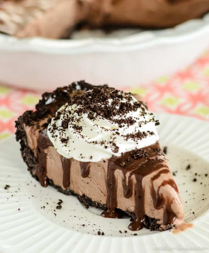 slice of mud pie with chocolate sauce and whipped cream