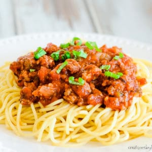 pasta with meaty sauce and fresh basil