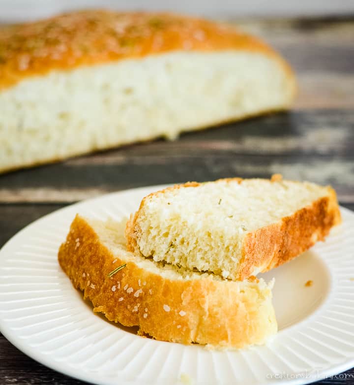 rustic rosemary bread sliced on a plate