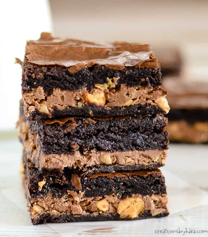 stack of candy bar brownies on waxed paper