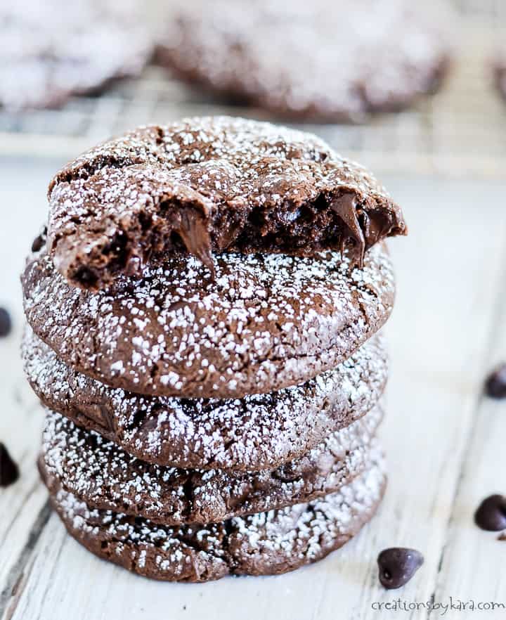 stack of chewy chocolate cookies sprinkled with powdered sugar