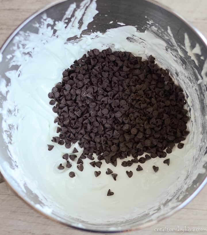 bowl of batter for easy meringue cookies with chocolate chips