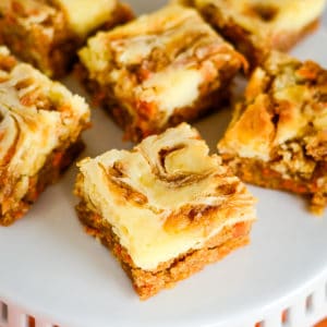 overhead shot of carrot cake bars on a cake stand