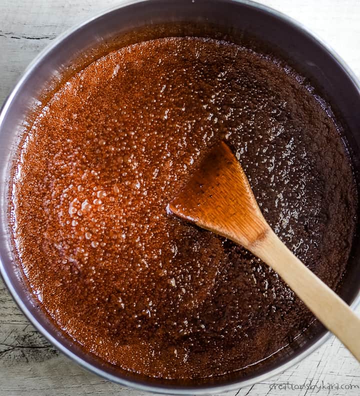 boiling peanut butter and chocolate no bake cookies in a heavy pan