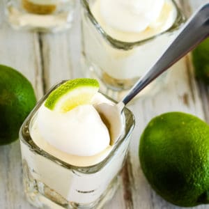 overhead shot of mini key lime cheesecake with a spoon in it