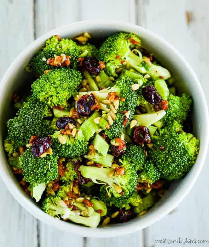 overhead shot of the best broccoli salad recipe with craisins and bacon