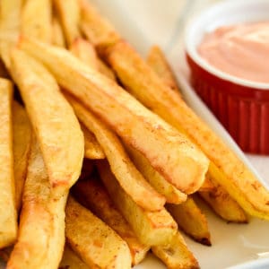 crispy oven french fries on a white tray