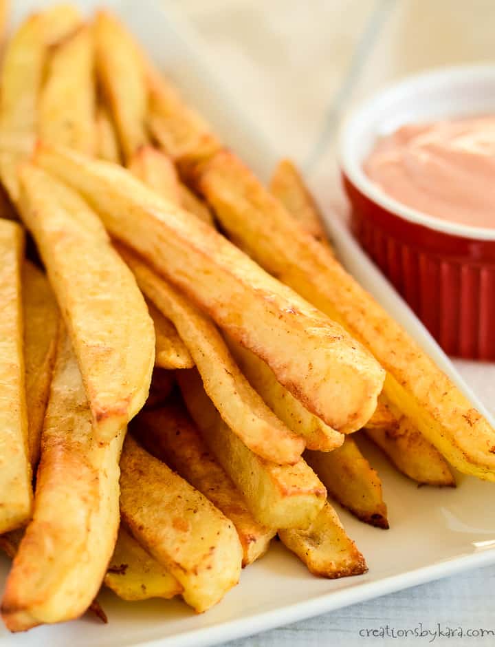 crispy oven french fries on a white tray
