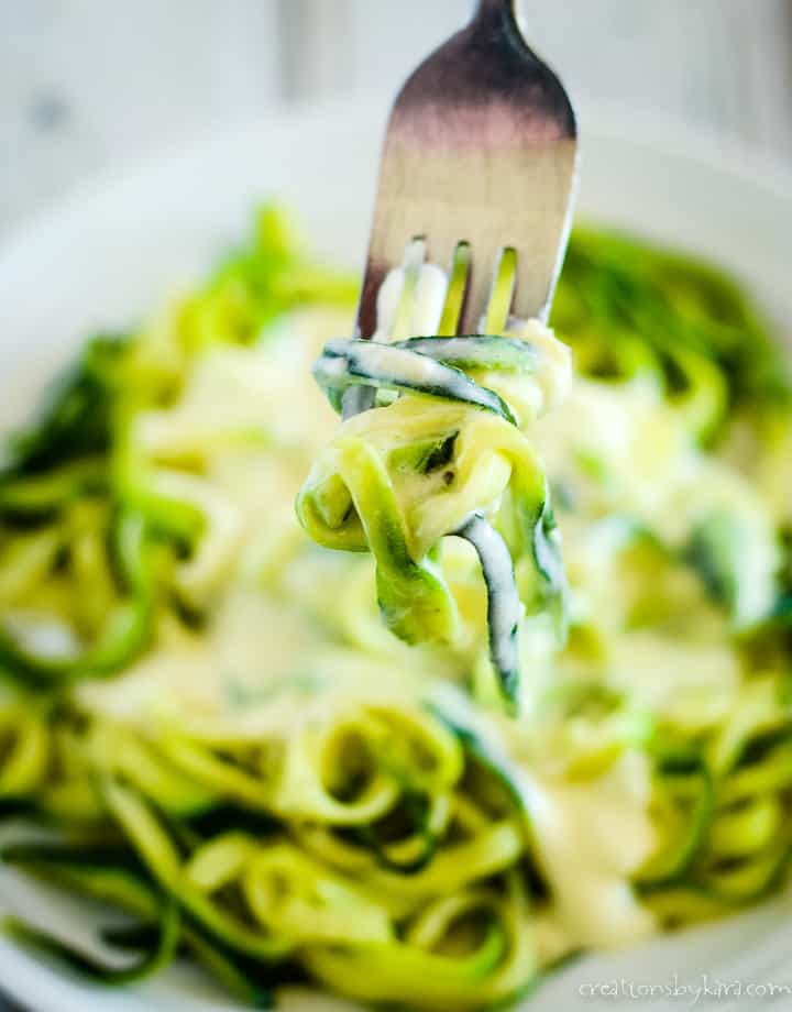 forkful of zoodles with low carb alfredo sauce