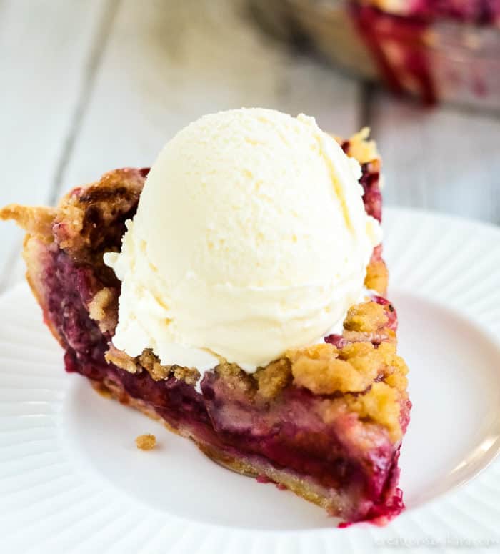 fresh plum pie topped with vanilla ice cream