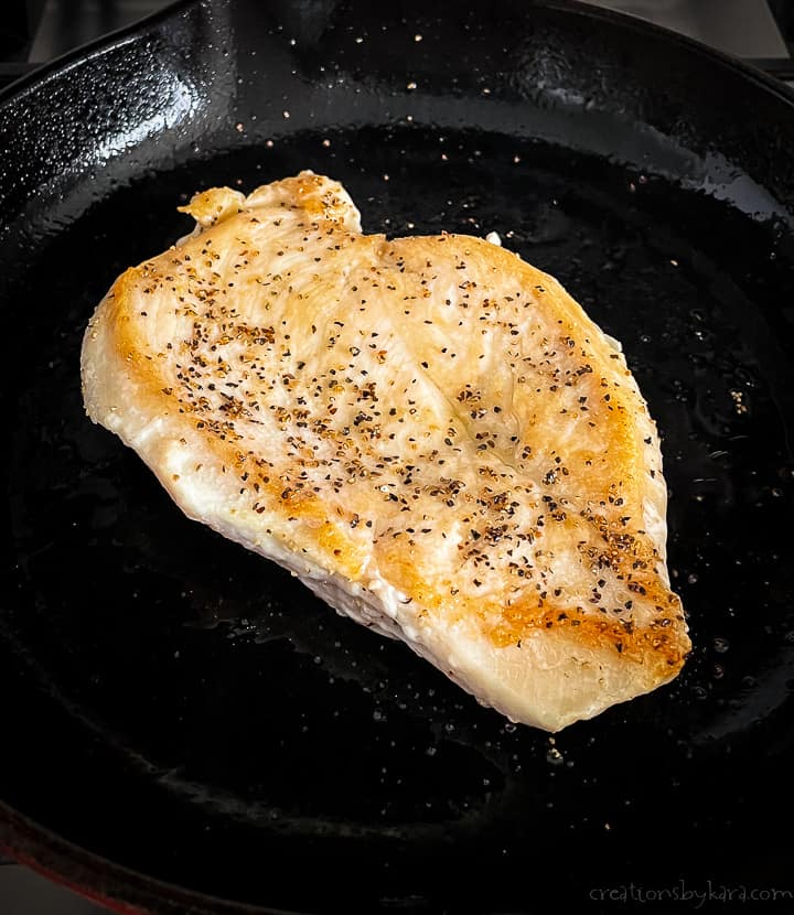 browned chicken breast in a skillet
