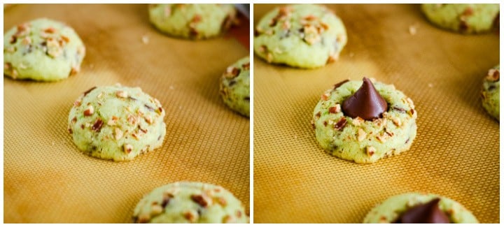 cookies on baking sheets being topped with a chocolate kiss