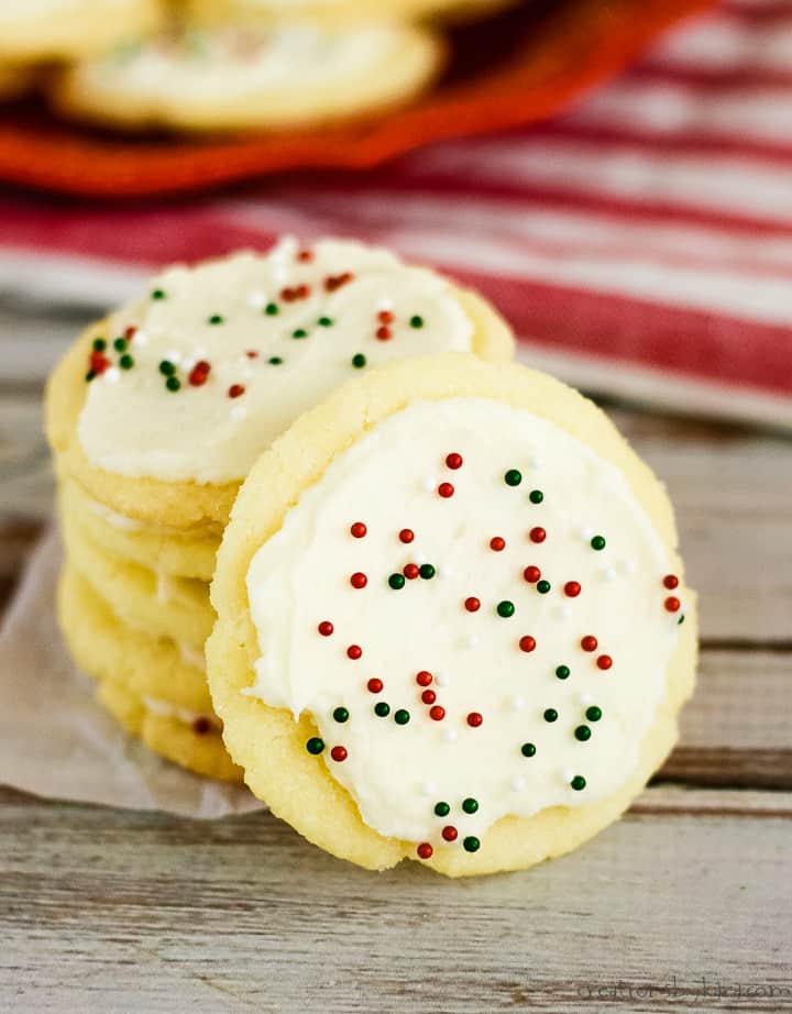 almond Christmas cookies withfrosting and red and green sprinkles