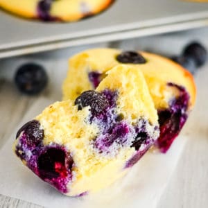 close up shot of halved low carb muffin with blueberries