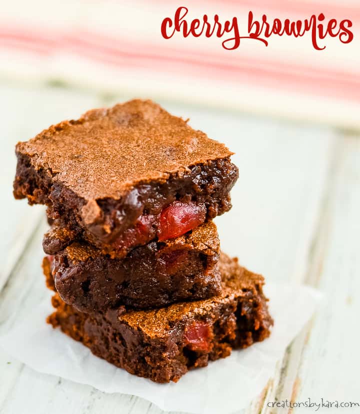 stack of cherry brownies on waxed paper