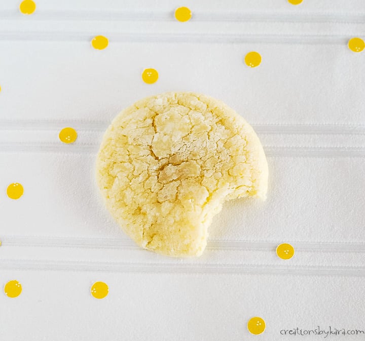 overhead shot of lemon cookie with powdered sugar with a bite taken out of it