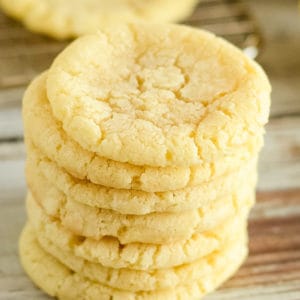 side shot of chewy lemon cookies with powdered sugar