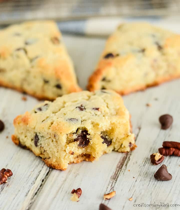 keto chocolate chip scones, one with a bite taken out of it