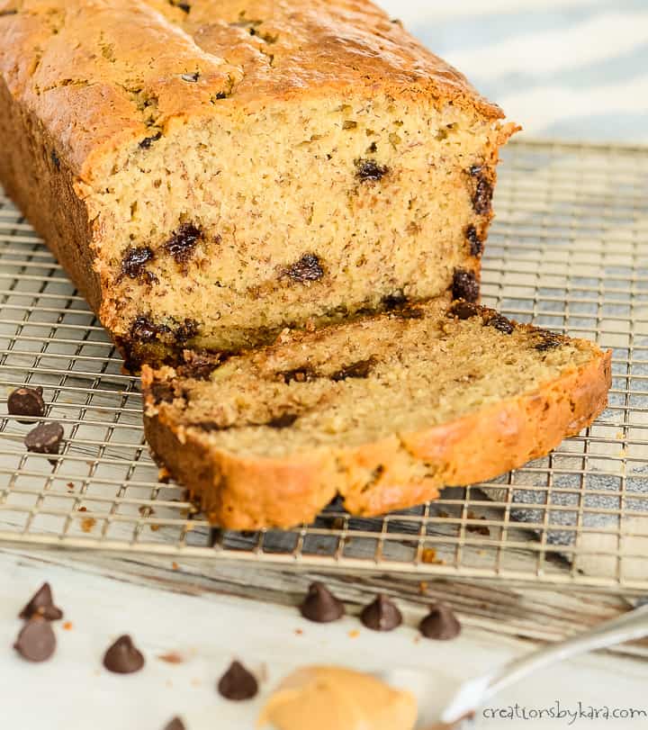 sliced loaf of peanut butter banana bread with chocolate chips