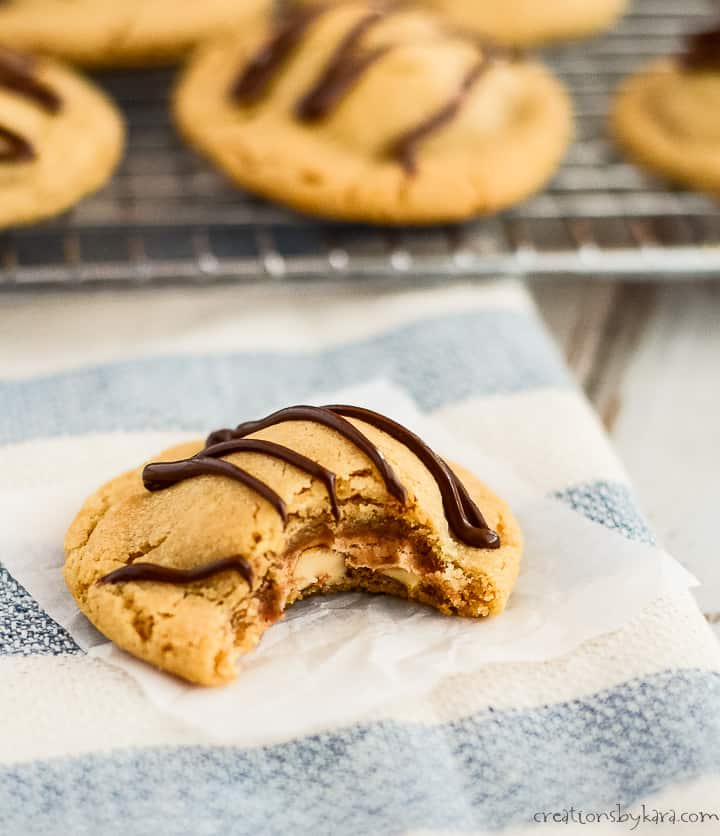snickers cookies drizzled with melted chocolate