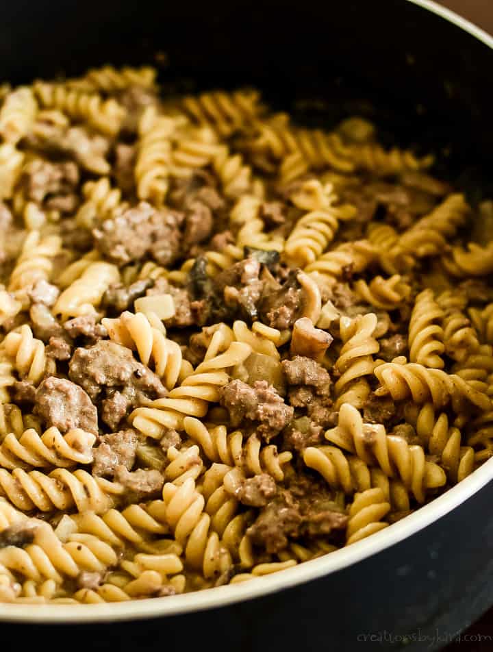 skillet of cooked hamburger and noodles with sour cream