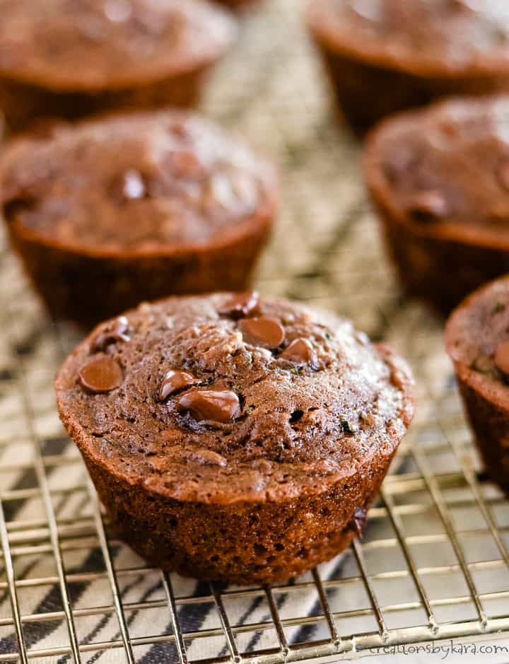 zucchini chocolate muffins on a cooling rack