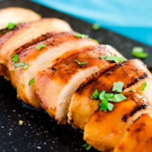 sliced marinated chicken breast garnished with chopped green onions