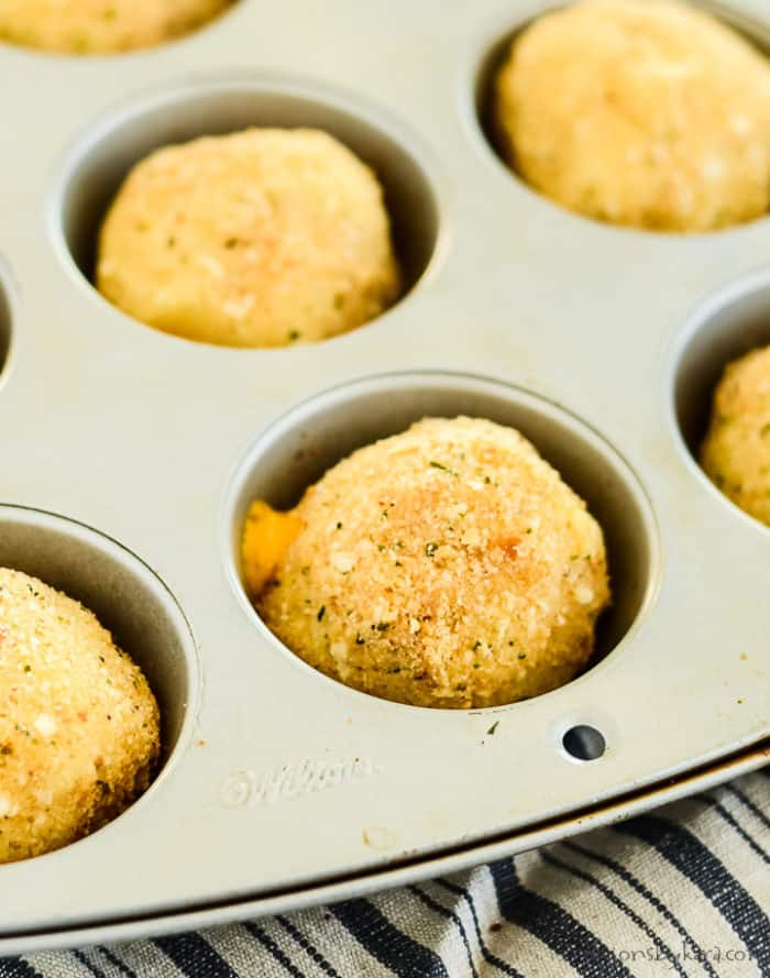 muffin tin with baked mashed potato balls