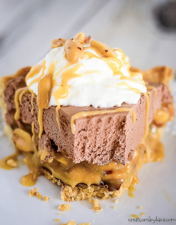 chocolate turtle pie with caramel sauce and peanuts