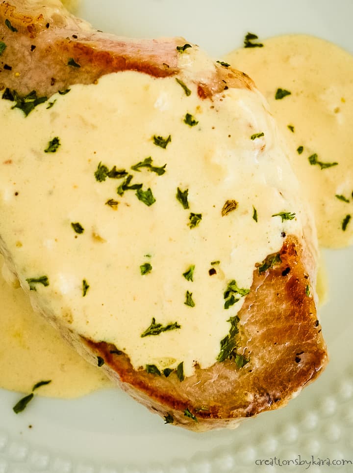 creamy garlic keto pork chops on a plate