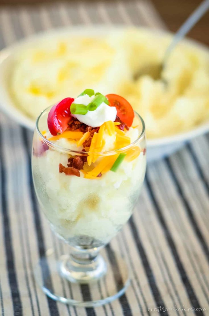 glass with mashed potatoes and all the toppings
