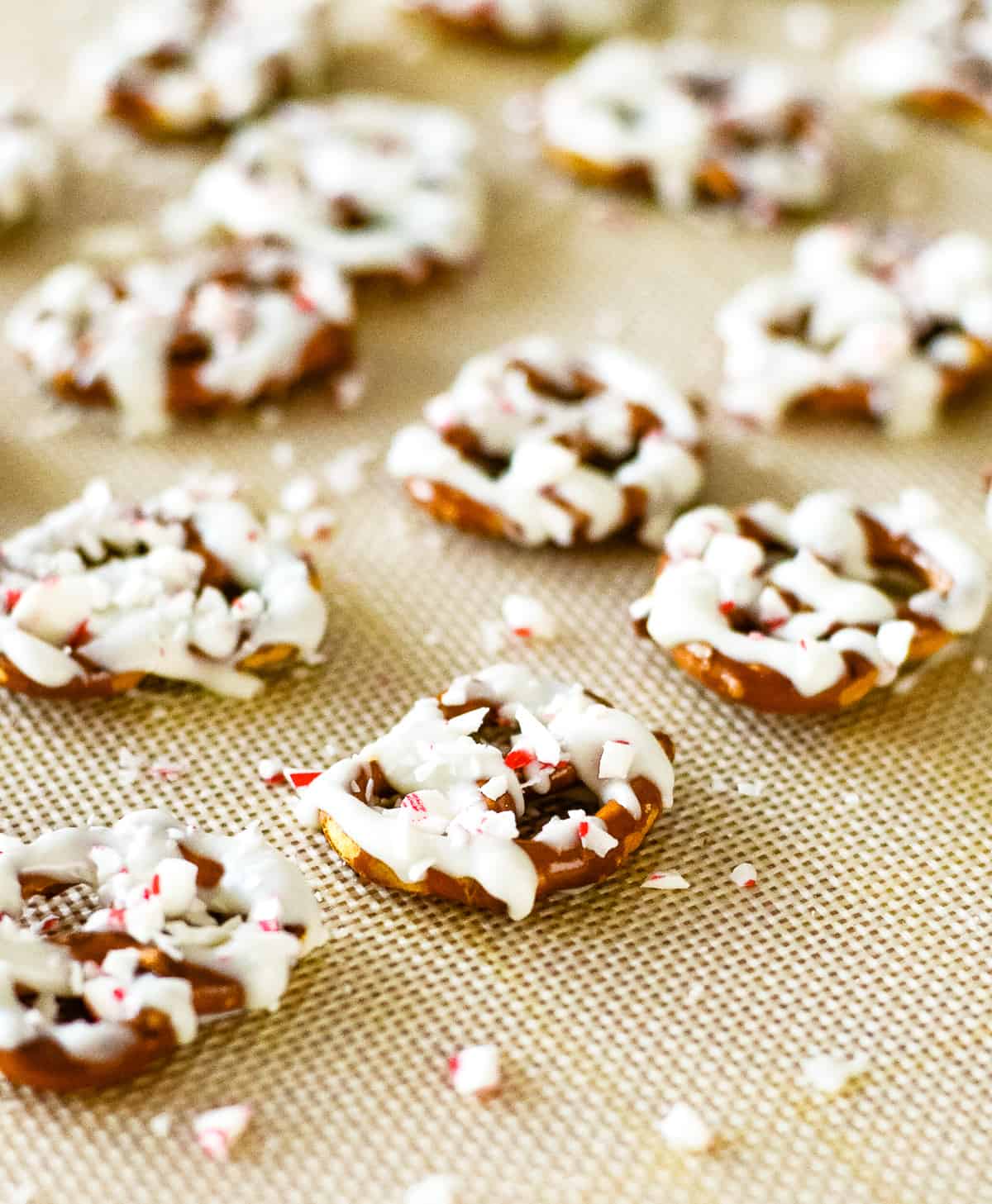 peppermint bark pretzels on a silicone liner