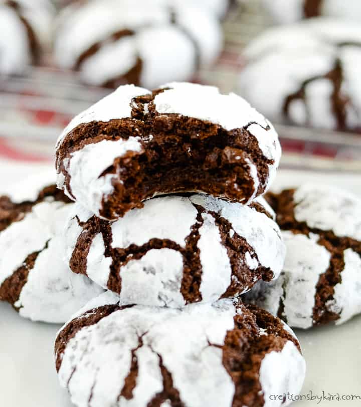 stack of chocolate crinkles, one with a bite taken out of it
