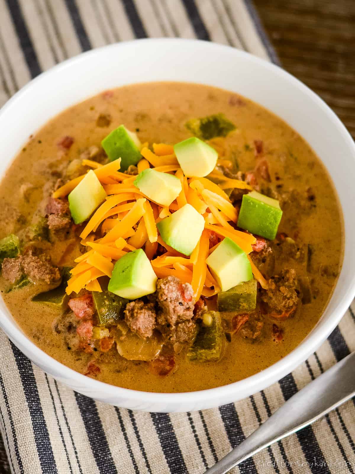 overhead shot of low carb mexican soup in a bowl with garnishes