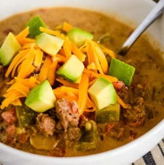 bowl of taco soup with rotel, avocadoes, and cheese