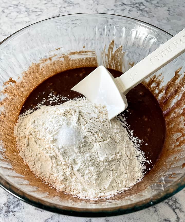 adding dry ingredients to cookies and cream brownies