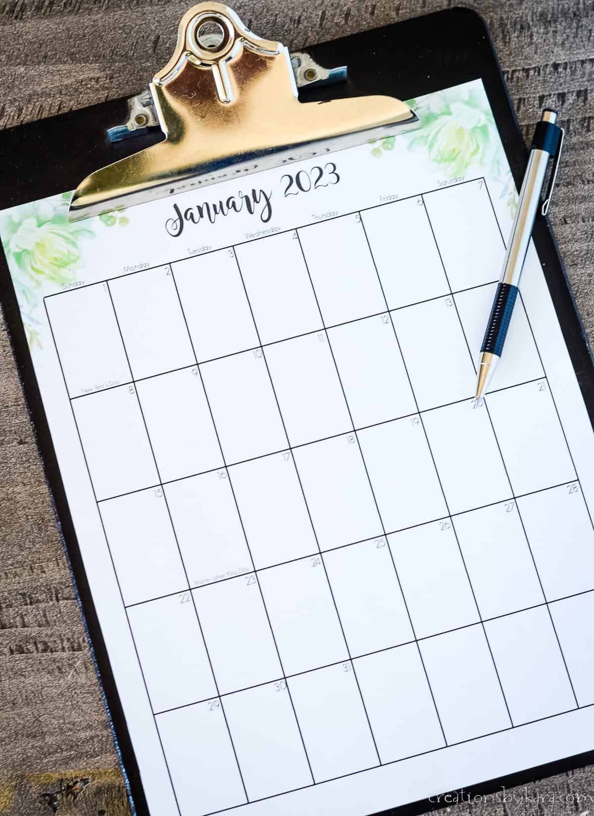 january 2023 calendar page on a clipboard