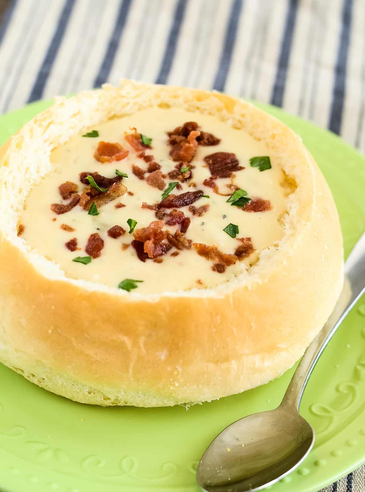 clam chowder bread bowl with bacon and parsley