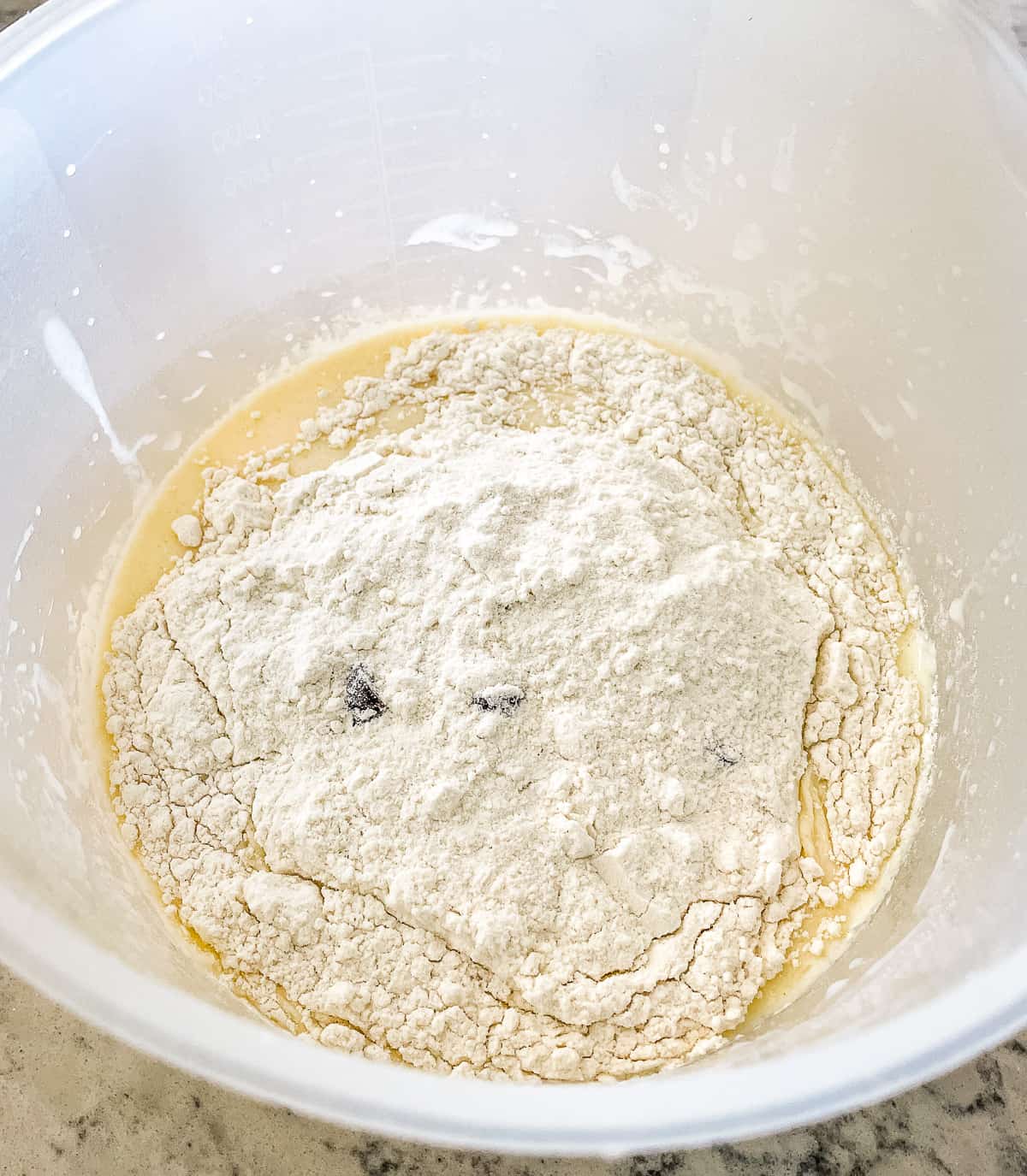 wet and dry ingredients for pancakes in a bowl