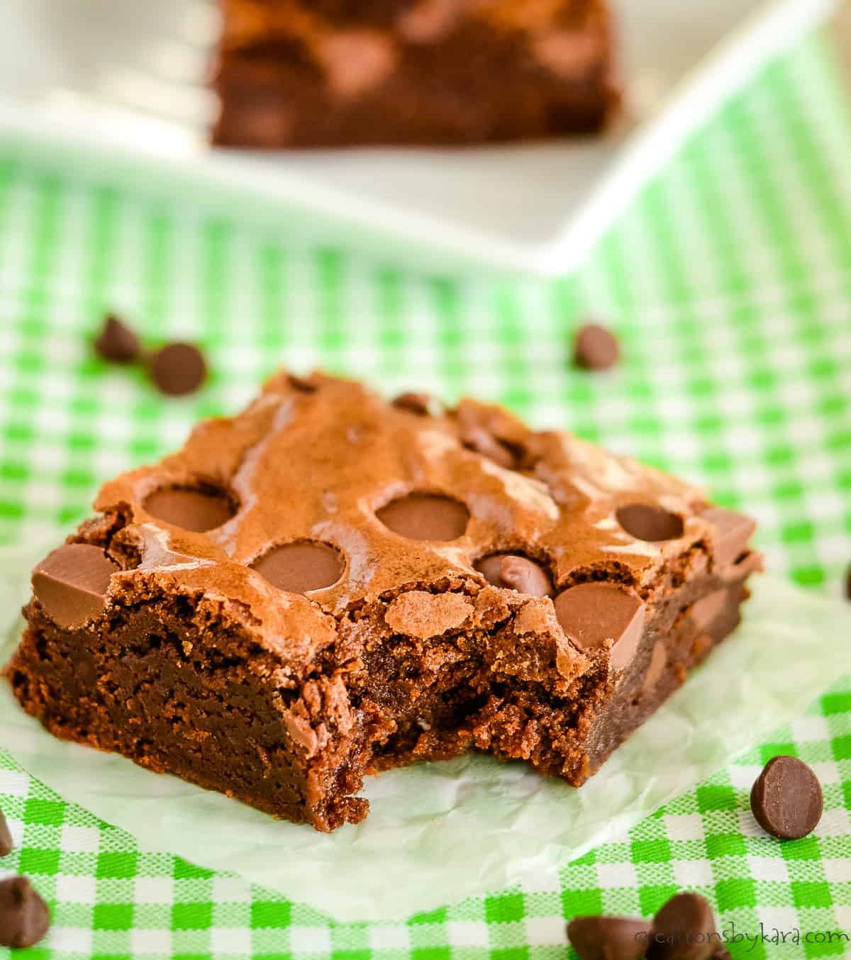 close up of chocolate chip brownie with a bite taken out of it