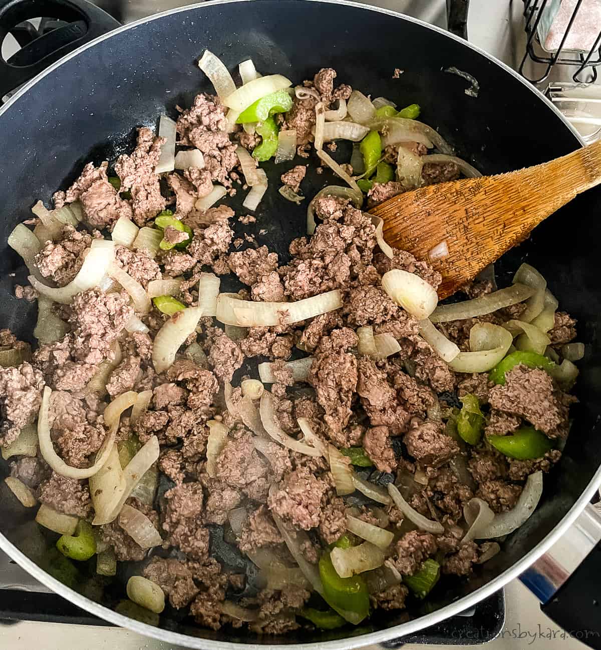 skillet with ground beef, onion, and celery