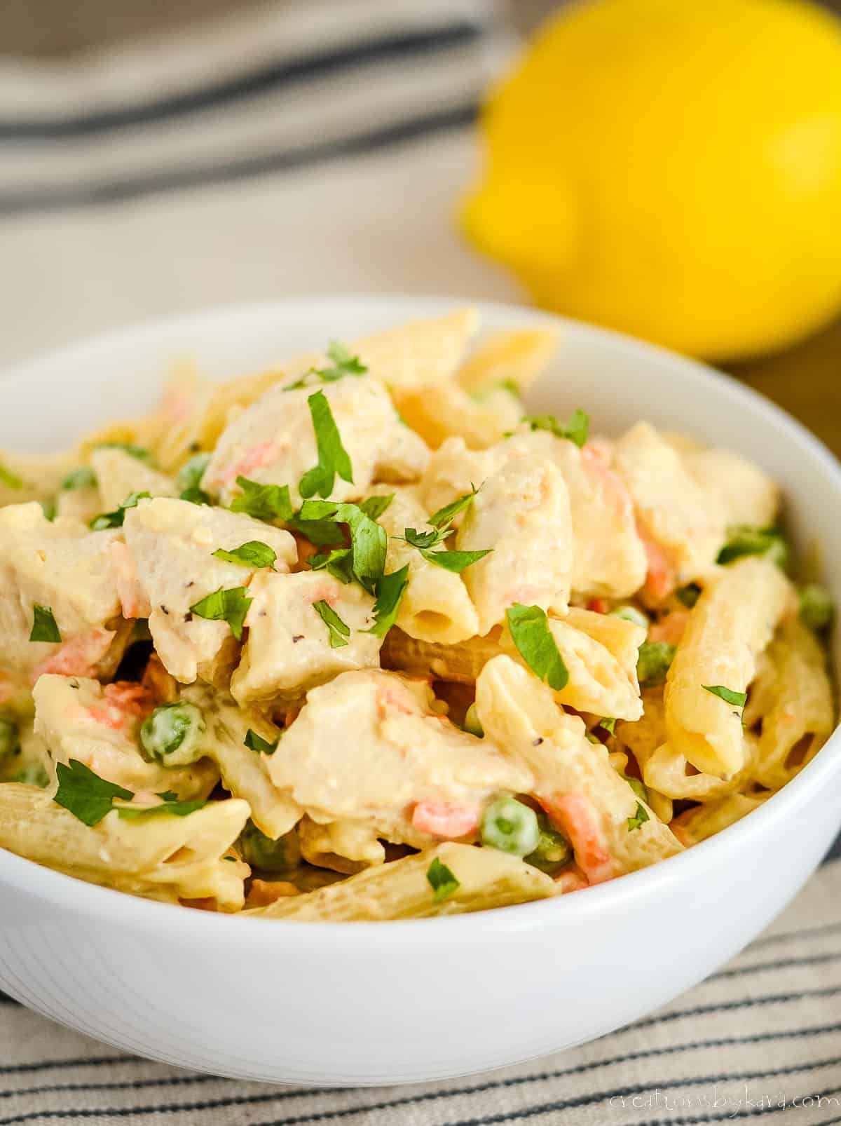 bowl of lemon pepper pasta with chicken and veggies